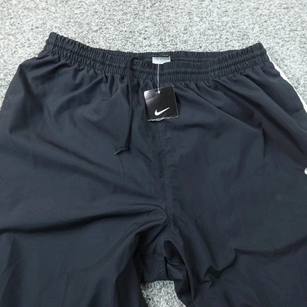 NEW Nike Pants Mens 2XL Black Baggy Swoosh Drawstring Windbreaker Track Workout